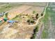 Sprawling acreage featuring a well-maintained home, outbuildings, and pastures at 4295 S County Road 193, Byers, CO 80103
