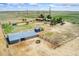 Aerial view of the property featuring barns and housing at 4295 S County Road 193, Byers, CO 80103