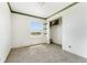 Bedroom with a window offering outside views and a walk-in closet at 4295 S County Road 193, Byers, CO 80103