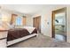 Bright bedroom features a full closet with easy access to an adjoining space at 4295 S County Road 193, Byers, CO 80103