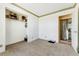 Bedroom with a walk-in closet and entrance to the laundry area at 4295 S County Road 193, Byers, CO 80103
