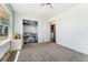 Neutral bedroom offers a large closet and convenient access to the laundry area at 4295 S County Road 193, Byers, CO 80103