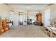 Bright bedroom featuring neutral carpet, walk-in closet, and abundant storage space at 4295 S County Road 193, Byers, CO 80103