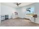 This cozy bedroom is freshly painted with an abundance of natural light from the large window at 4295 S County Road 193, Byers, CO 80103