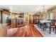 Open kitchen flows into dining area under chandelier lighting at 4295 S County Road 193, Byers, CO 80103