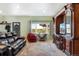 Cozy living room showcasing built-in shelving and exterior view at 4295 S County Road 193, Byers, CO 80103