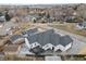 A view from above shows the modern home and the large patio area at 12215 Viewpoint Dr, Lakewood, CO 80401