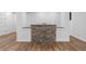 Basement bar area with stone accents, offering a cozy and inviting space for gatherings at 12215 Viewpoint Dr, Lakewood, CO 80401
