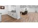 Spacious basement featuring a bar area, cabinets, sink, and open layout, ideal for recreation and relaxation at 12215 Viewpoint Dr, Lakewood, CO 80401