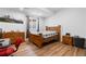 Bright bedroom with wood-look flooring, and picture window for bright natural light at 12215 Viewpoint Dr, Lakewood, CO 80401