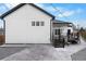 Exterior view of home showing elevated deck with steps down to the backyard space at 12215 Viewpoint Dr, Lakewood, CO 80401