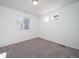 Simple bedroom featuring neutral carpeting and a window, offering a bright and airy space at 46505 Avery Ln, Commerce City, CO 80022