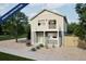 Charming two-story home with a balcony and neutral siding offers modern living with a welcoming facade at 46505 Avery Ln, Bennett, CO 80022