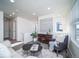 Well-lit living room featuring modern decor and light-colored floors at 46505 Avery Ln, Bennett, CO 80022