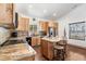 Charming kitchen featuring custom wood cabinets, granite countertops, and a kitchen island at 445 Beaver Rd # 4, Idaho Springs, CO 80452