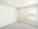 Well-lit bedroom featuring neutral carpet, fresh white walls, and a window with a neighborhood view at 741 N Tibet St, Aurora, CO 80018