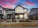 Stylish two-story townhome showcasing modern design with a mix of siding and stone accents at 741 N Tibet St, Aurora, CO 80018