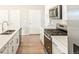 Modern kitchen featuring stainless steel appliances and a breakfast bar at 741 N Tibet St, Aurora, CO 80018