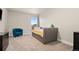 Bedroom with a bed, dark dresser and a comfortable chair at 208 Dorothy Dr, Berthoud, CO 80513