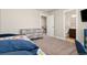 Comfortable bedroom featuring a dresser and easy access to the bathroom at 208 Dorothy Dr, Berthoud, CO 80513