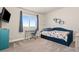 Cozy bedroom with a trundle bed, a work desk, and a bright window at 208 Dorothy Dr, Berthoud, CO 80513
