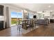 Open concept dining room with natural light and sliding glass doors to the yard at 208 Dorothy Dr, Berthoud, CO 80513
