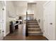 Open entryway with hardwood floors, stairs and study nook at 208 Dorothy Dr, Berthoud, CO 80513