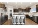 Kitchen featuring an island with seating and stainless steel appliances at 208 Dorothy Dr, Berthoud, CO 80513