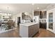Open-concept kitchen with a large island, eat-in table and living room at 208 Dorothy Dr, Berthoud, CO 80513