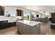 Kitchen with a kitchen island, stainless steel appliances and eat-in table at 208 Dorothy Dr, Berthoud, CO 80513
