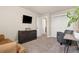 Comfortable living room featuring a sofa, an arm chair, and a dresser at 208 Dorothy Dr, Berthoud, CO 80513