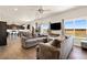 Open concept living room with backyard views at 208 Dorothy Dr, Berthoud, CO 80513