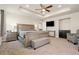 Spacious main bedroom with a large bed, dresser, and sitting area at 208 Dorothy Dr, Berthoud, CO 80513