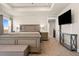 Spacious main bedroom featuring a tray ceiling, carpet flooring, and a large bed at 208 Dorothy Dr, Berthoud, CO 80513