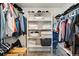 Well-organized walk-in closet with ample shelving and hanging space for clothes and storage at 208 Dorothy Dr, Berthoud, CO 80513
