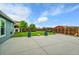 Spacious backyard featuring a concrete patio and well-maintained lawn at 243 Cherokee Ct, Brighton, CO 80603