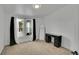 Bright bedroom featuring plush carpet, desk, and a full-length mirror by the large window at 243 Cherokee Ct, Brighton, CO 80603