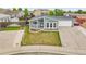 Charming single-story home with a well-manicured lawn, flower beds, and an attached two-car garage at 243 Cherokee Ct, Brighton, CO 80603