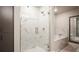 Modern bathroom with a glass-enclosed shower, soaking tub, and sleek vanity offers a spa-like experience at 20 Wilcox St # 302, Castle Rock, CO 80104