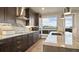 Modern kitchen with stainless steel appliances, sleek cabinetry, and a large island with a sink at 20 Wilcox St # 302, Castle Rock, CO 80104