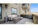 Inviting patio with a cozy seating area, fire table, and scenic views at 20 Wilcox St # 302, Castle Rock, CO 80104