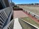 Well-maintained backyard featuring decorative rock, newly planted greenery, and partial grass coverage at 1055 Snowberry Ave, Elizabeth, CO 80107