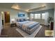 Modern bedroom with blue accents and ocean view at 1055 Snowberry Ave, Elizabeth, CO 80107