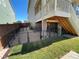 Fenced-in dog run with gravel and grass, providing a safe and playful outdoor space for pets at 1055 Snowberry Ave, Elizabeth, CO 80107