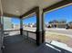 Charming covered front porch with decorative columns offers a relaxing outdoor space and neighborhood views at 1055 Snowberry Ave, Elizabeth, CO 80107