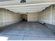 Spacious two-car garage with high ceilings and concrete flooring, ready for customization and storage at 1055 Snowberry Ave, Elizabeth, CO 80107