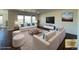 Bright living room featuring modern furniture, a mounted TV, and stylish decor at 1055 Snowberry Ave, Elizabeth, CO 80107