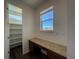 A walk-in pantry with granite counter and window for natural light is perfect for food storage at 1055 Snowberry Ave, Elizabeth, CO 80107
