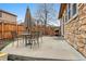 Backyard with outdoor seating, lush greenery, and a fenced yard at 2958 S Lisbon Way, Aurora, CO 80013