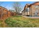 Lush backyard featuring a well-maintained lawn and wood fencing at 2958 S Lisbon Way, Aurora, CO 80013